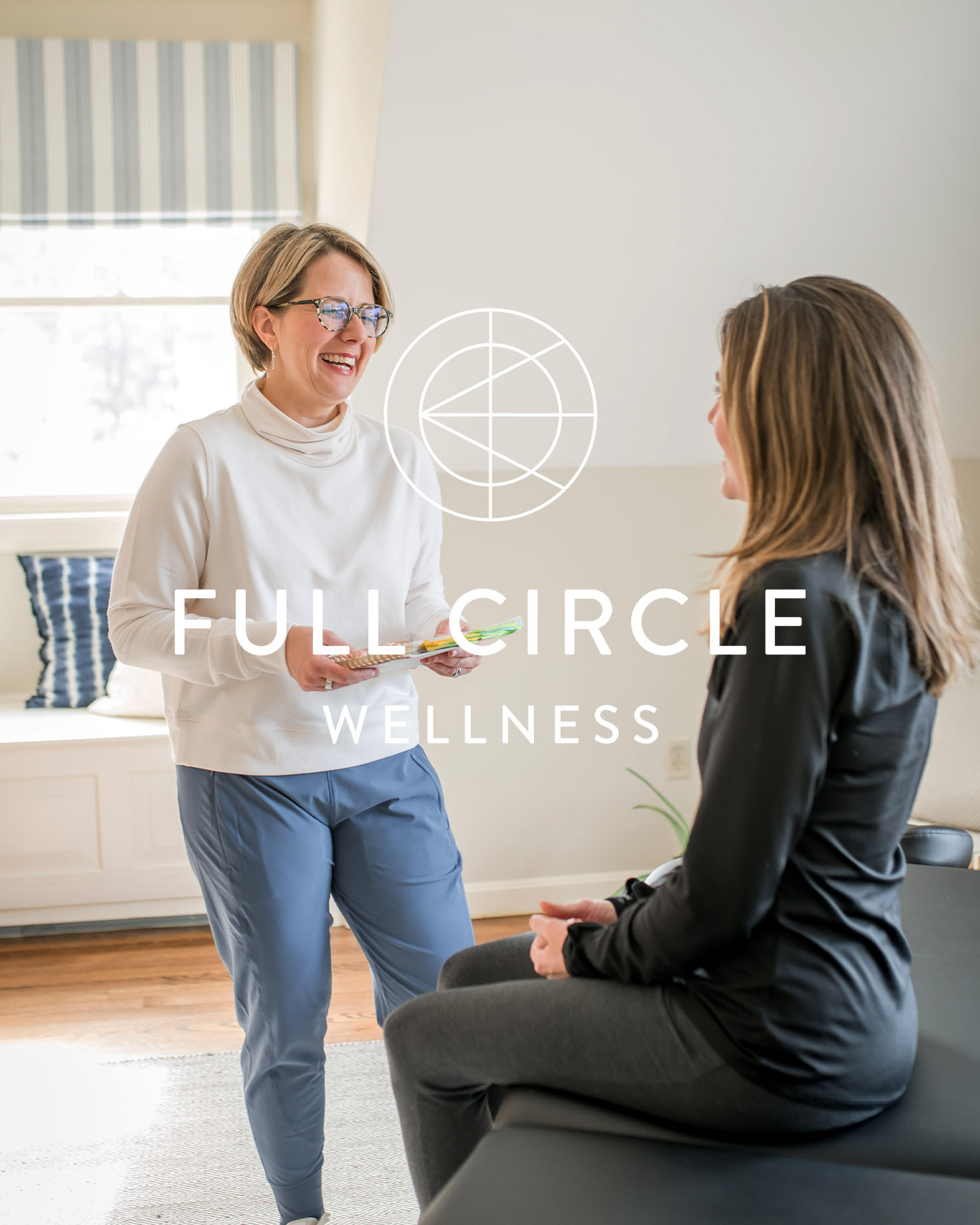 Jessica McManus of Full Circle Wellness smiling while engaging in a one-on-one health coaching session with a client.