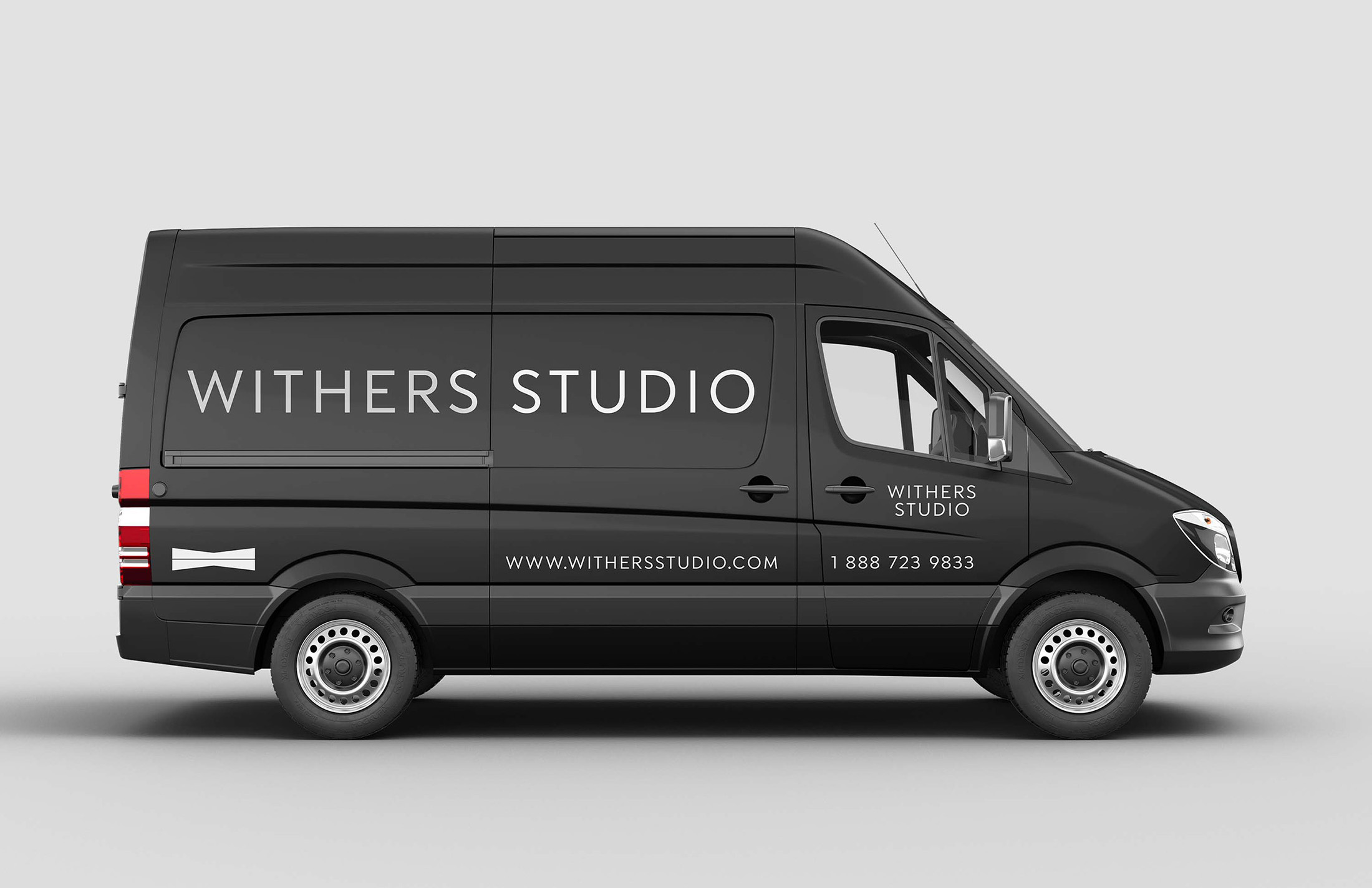 Custom-branded Withers Studio delivery van, highlighting professional identity with modern logo and contact details.