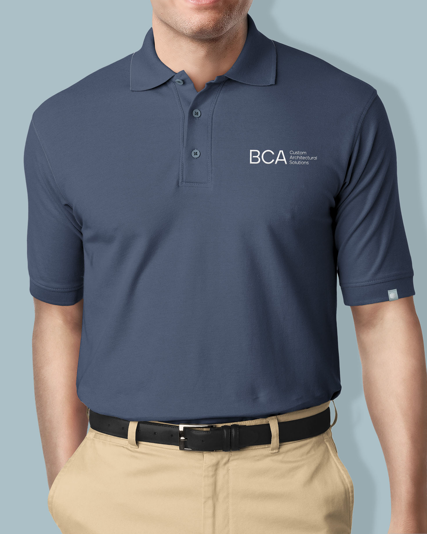 B&C Awnings branded polo shirt featuring the logo and subtle design, showcasing professional attire for company representatives.