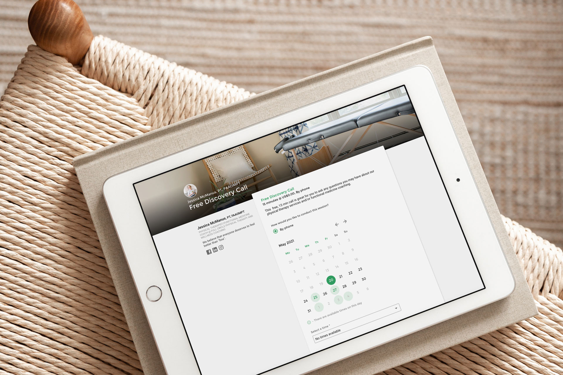 A tablet on a woven surface showing the Full Circle Wellness discovery call scheduling page with clean, modern design elements.