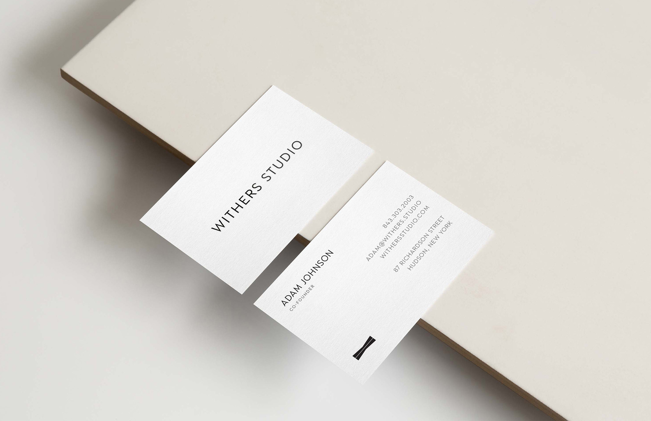 Minimalist business card design for Withers Studio, showcasing refined branding with clean typography and modern layout elements.