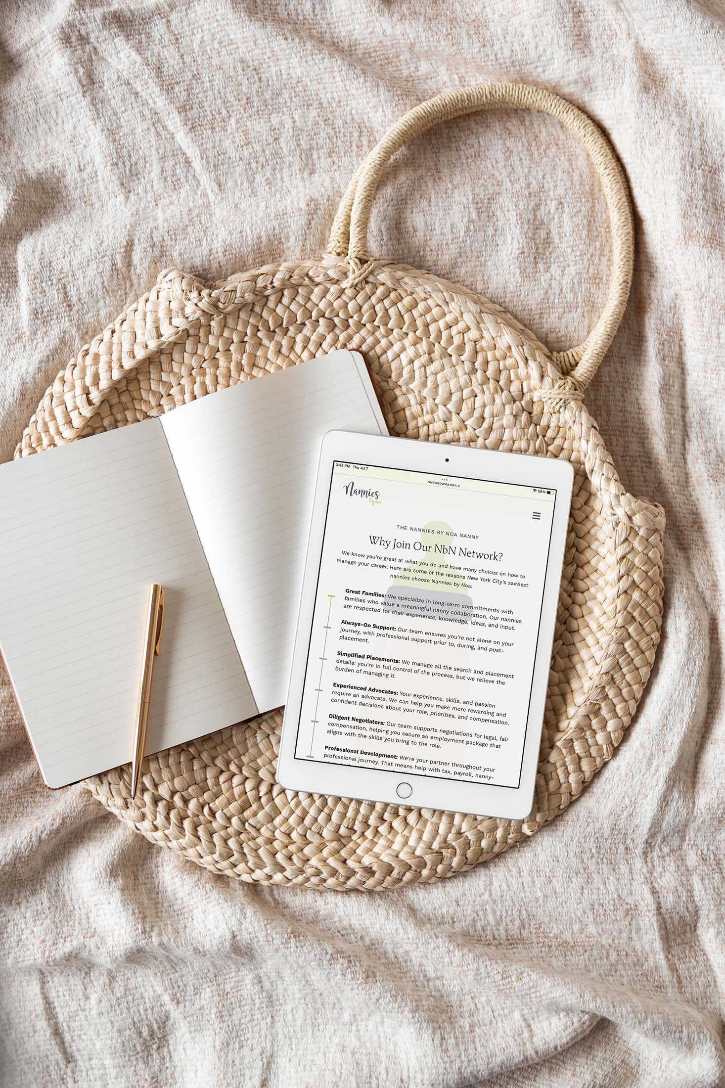 Tablet displaying the Nannies by Noa “Why Join Our NbN Network?” page on a woven basket with an open notebook and pen, emphasizing professionalism and recruitment.