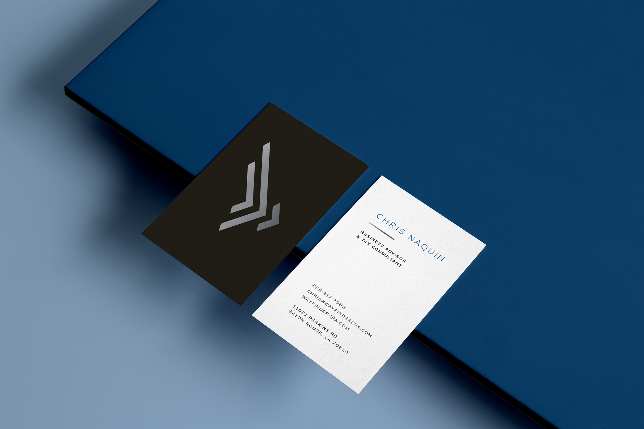 Professional business cards for Wayfinder CPA, showcasing the modern logo design and contact details for Chris Naquin, Business Advisor and Tax Consultant.