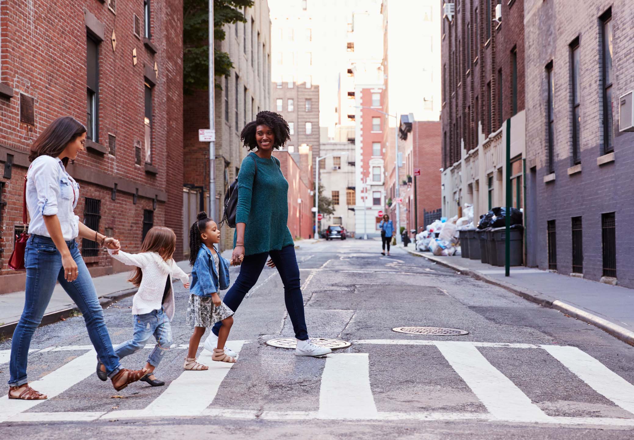 Nannies walking outdoors in a New York City neighborhood, emphasizing the agency’s personalized and mindful childcare placements.