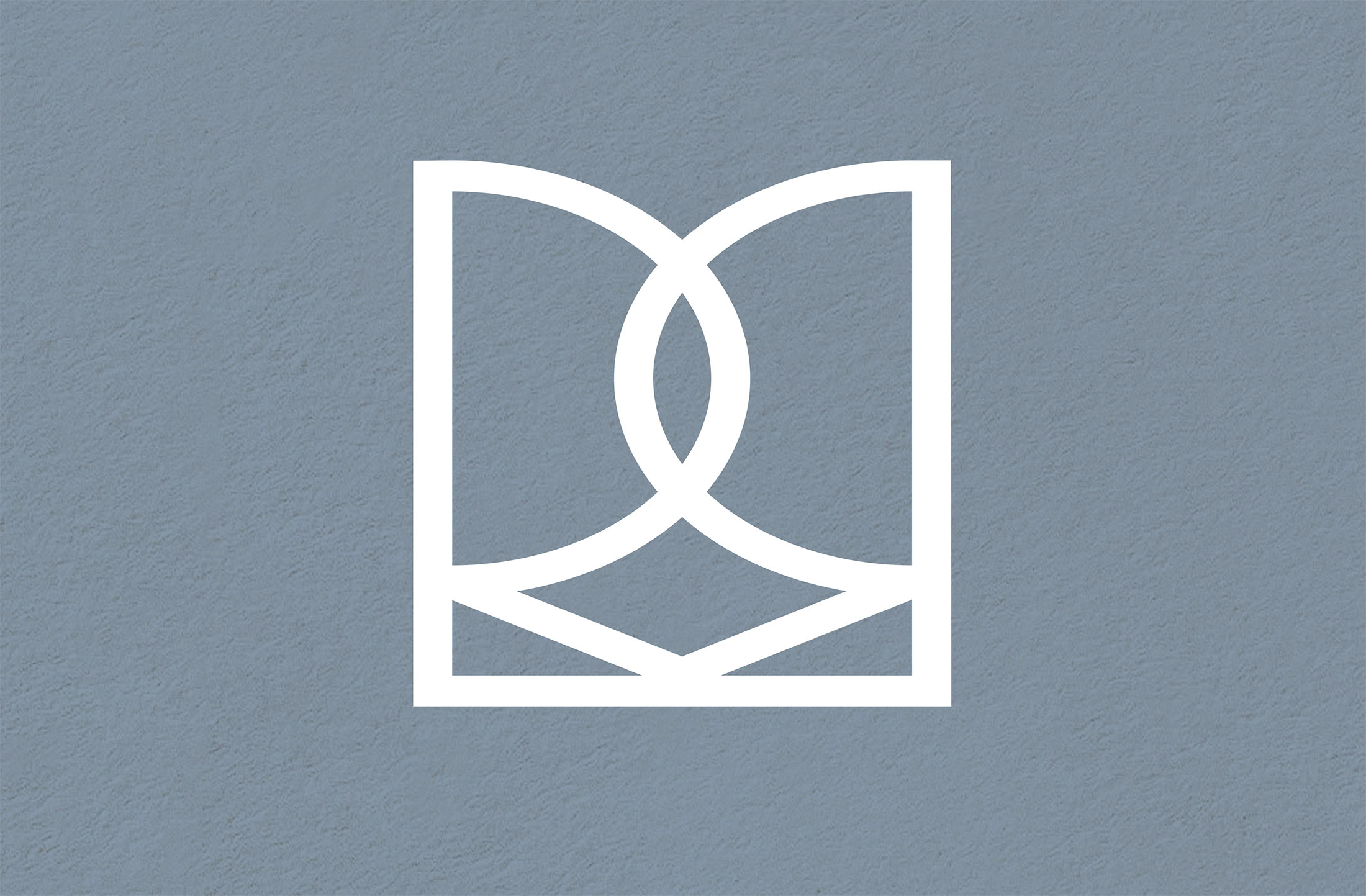 Rebecca Mansell’s abstract logo design in white, resembling an open book, displayed on a textured blue-gray background, representing knowledge and opportunity.