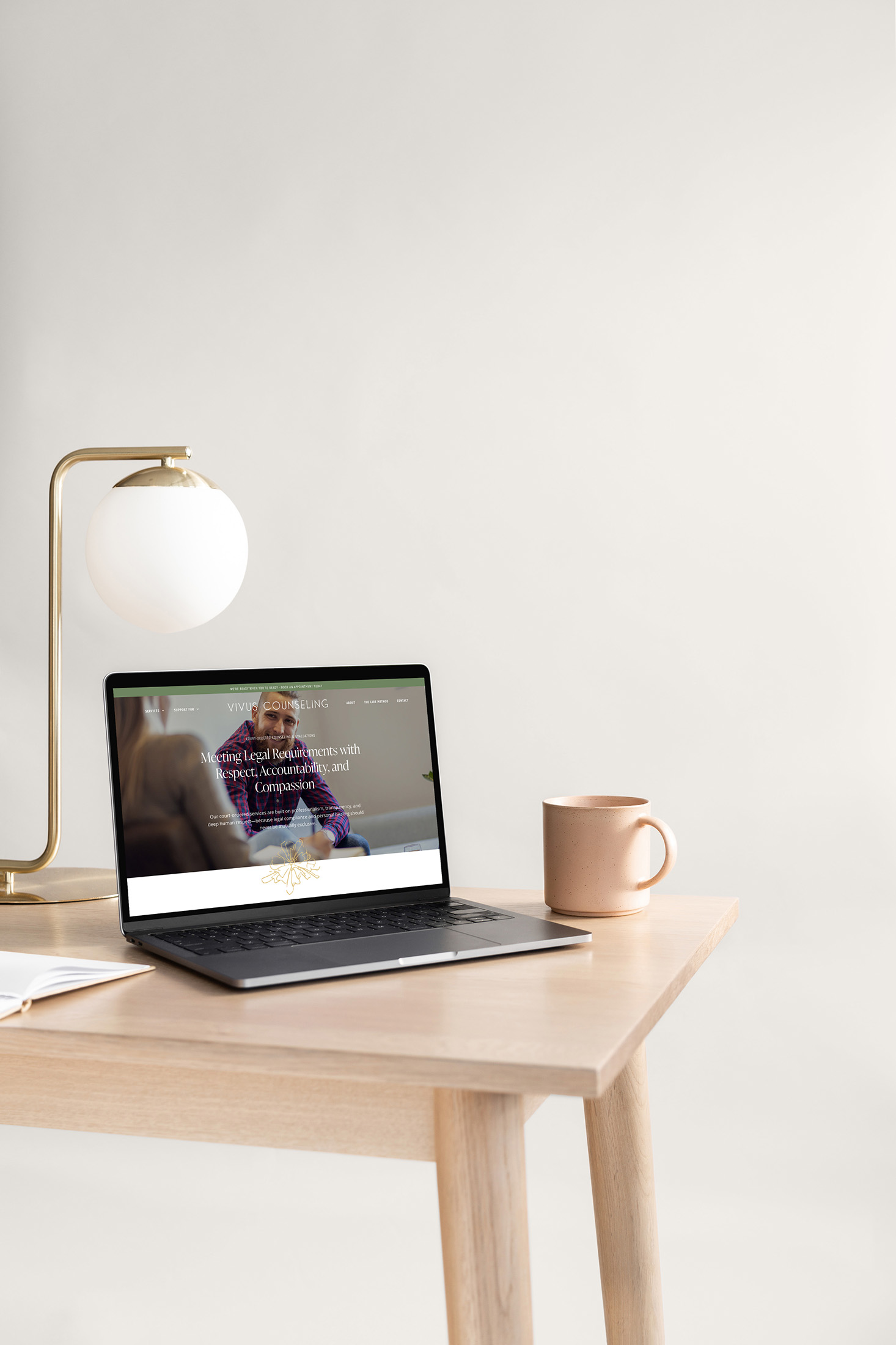Vivus Counseling website shown on a laptop beside a lamp and mug, highlighting modern therapy branding and compassionate counseling services.
