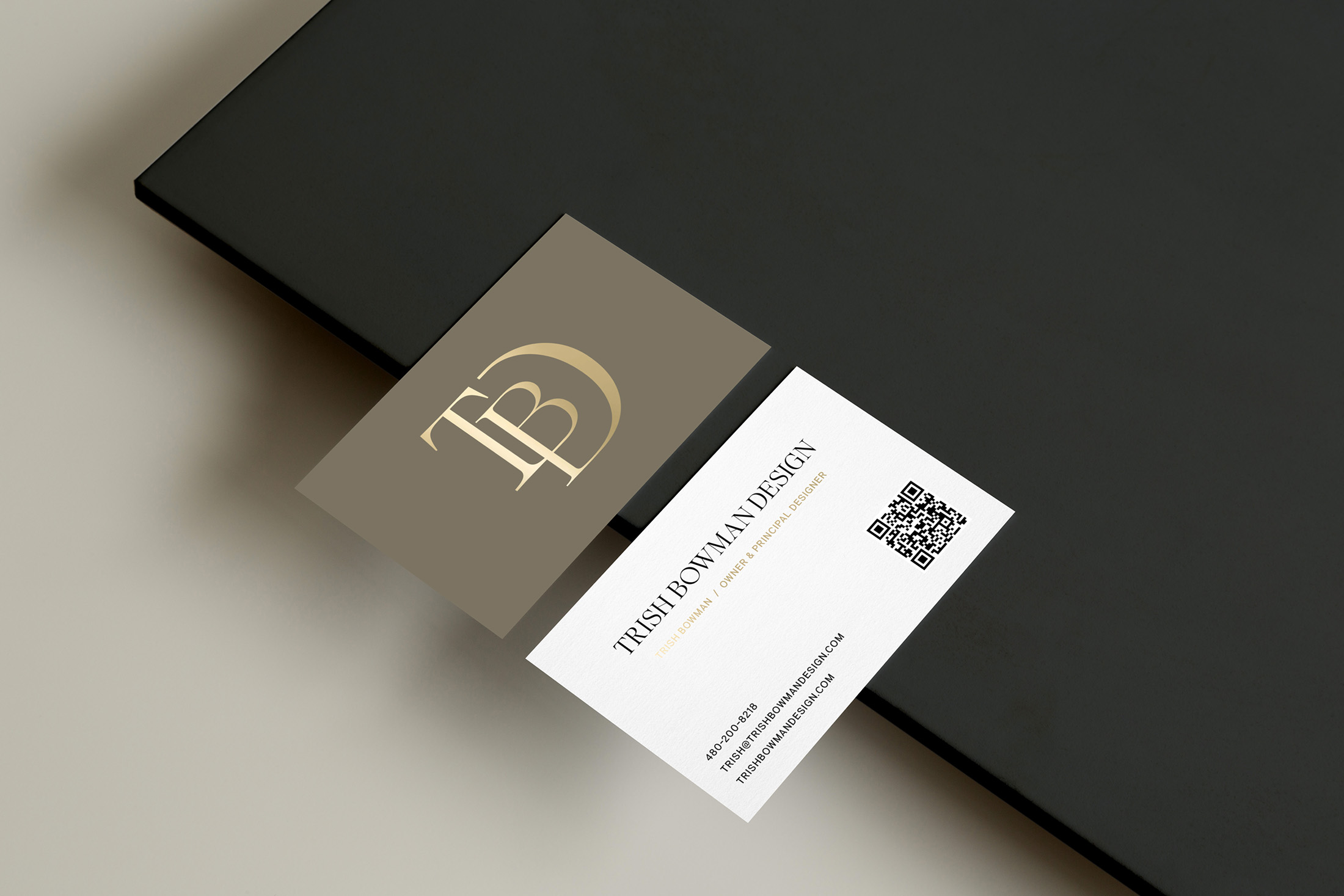 Double-sided business cards for Trish Bowman Design with minimalist typography, branded colors, and QR code.