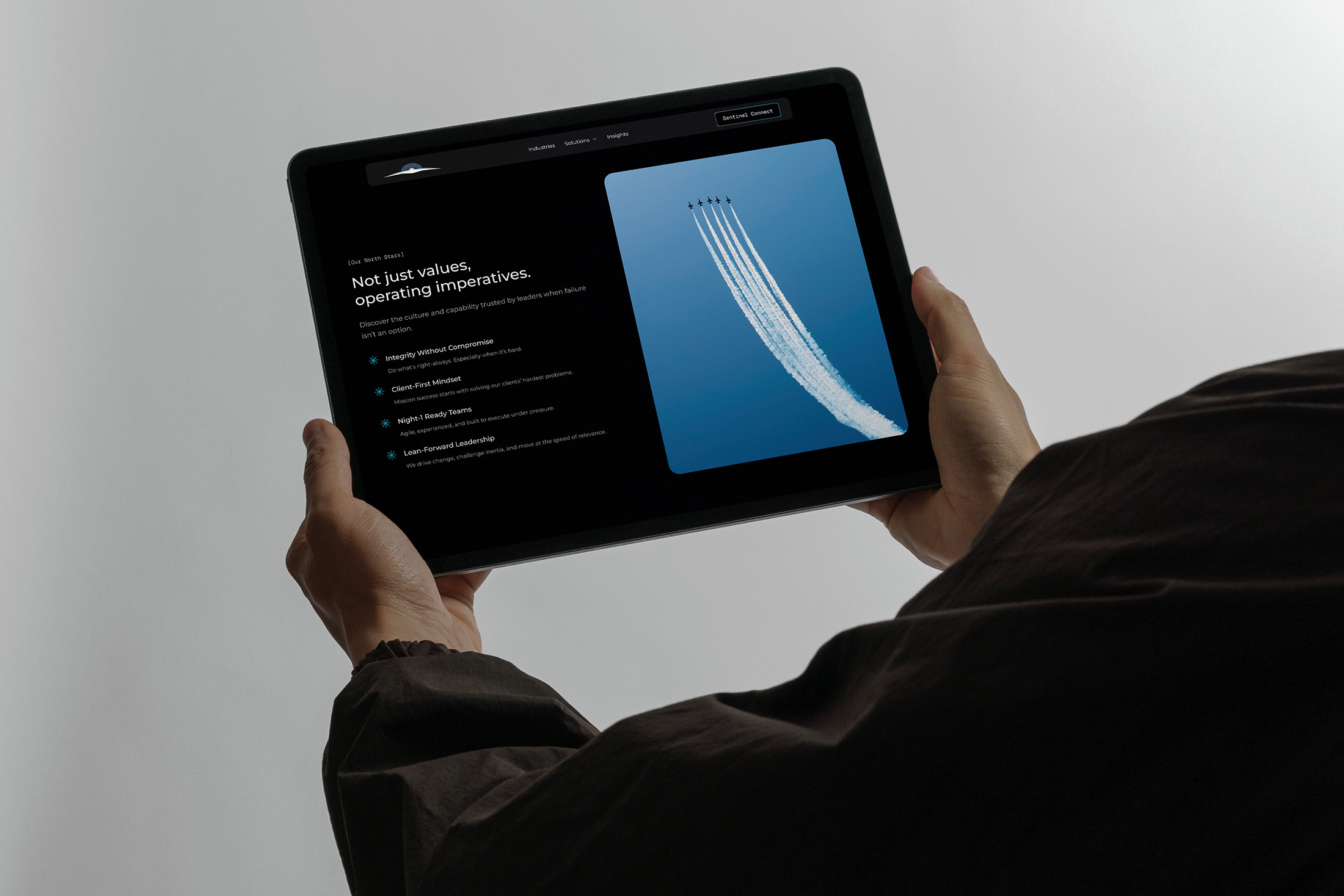 Sentinel Horizon values and culture webpage displayed on a tablet featuring a jet formation image