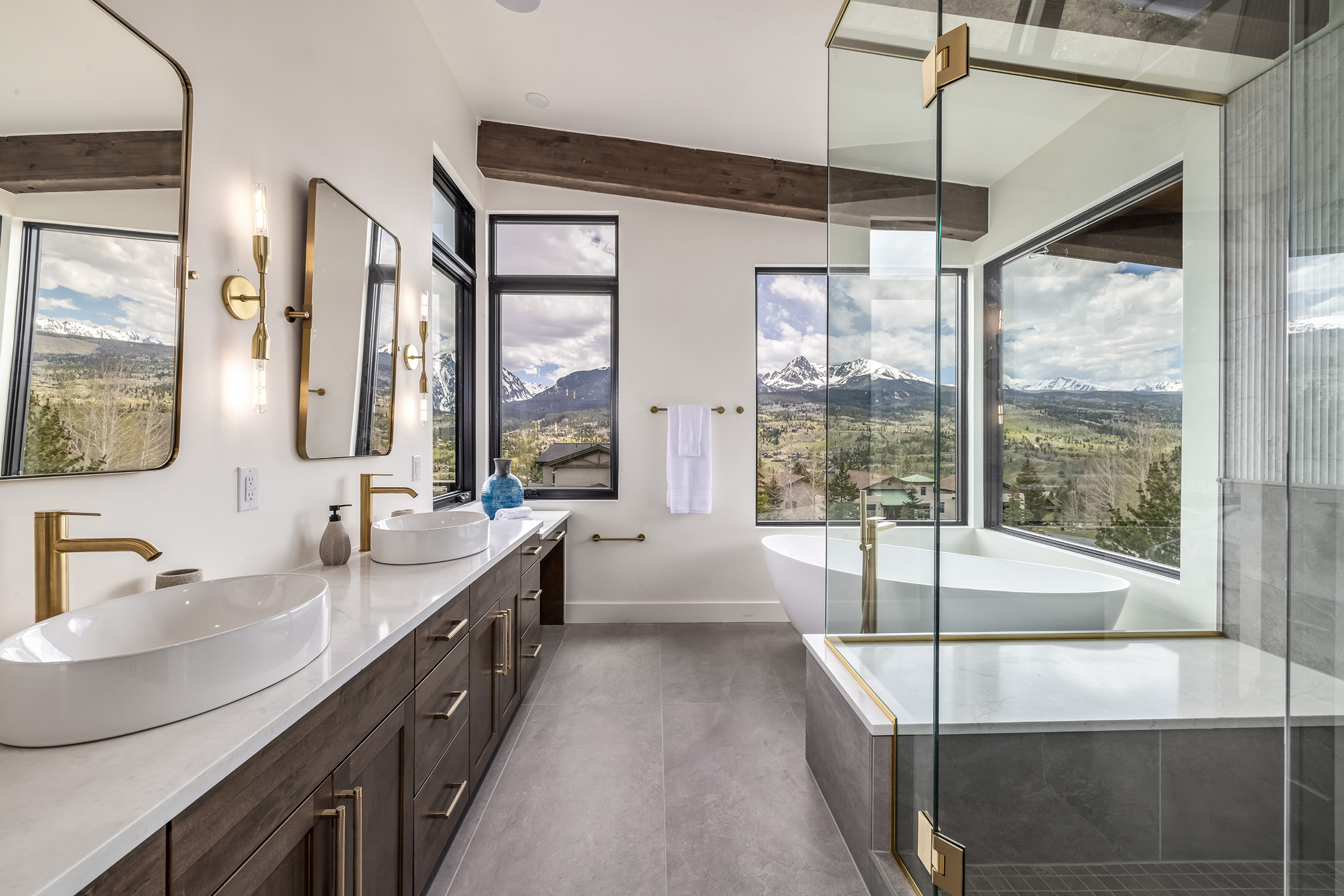 Luxury mountain bathroom with freestanding tub and panoramic views built by Sweet Homes of Colorado