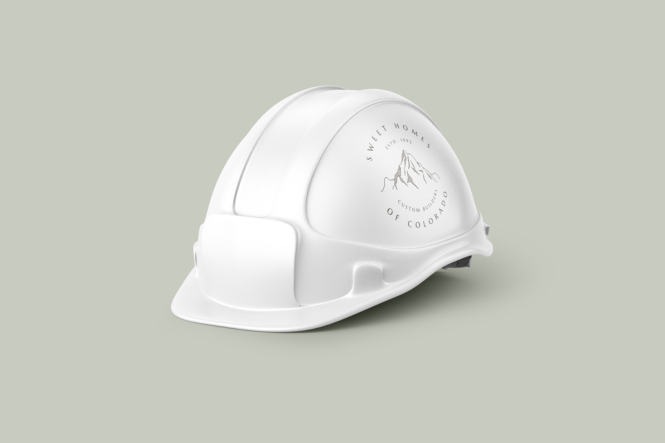 Sweet Homes of Colorado branded construction hard hat featuring mountain logo